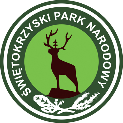 Okrągłe logo Świętokrzyskiego Parku Narodowego z jeleniem z krzyżem na środku poroża.